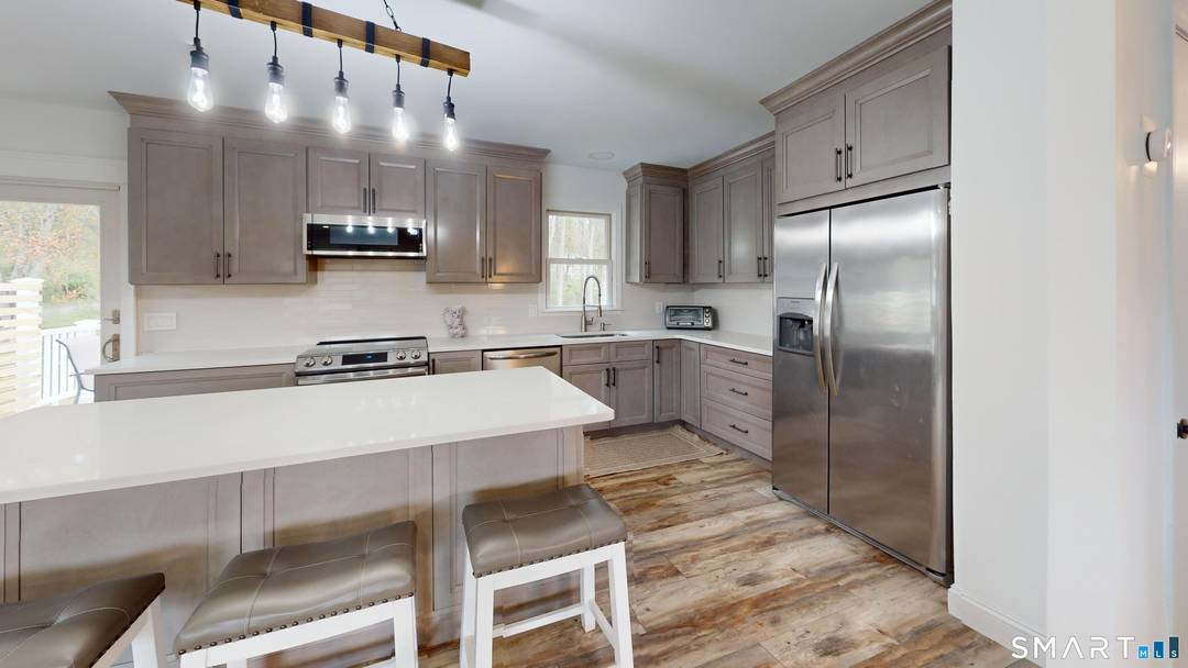 Beautifully updated Raised Ranch rental in a quiet Mystic side Stonington neighborhood set on nearly an acre.