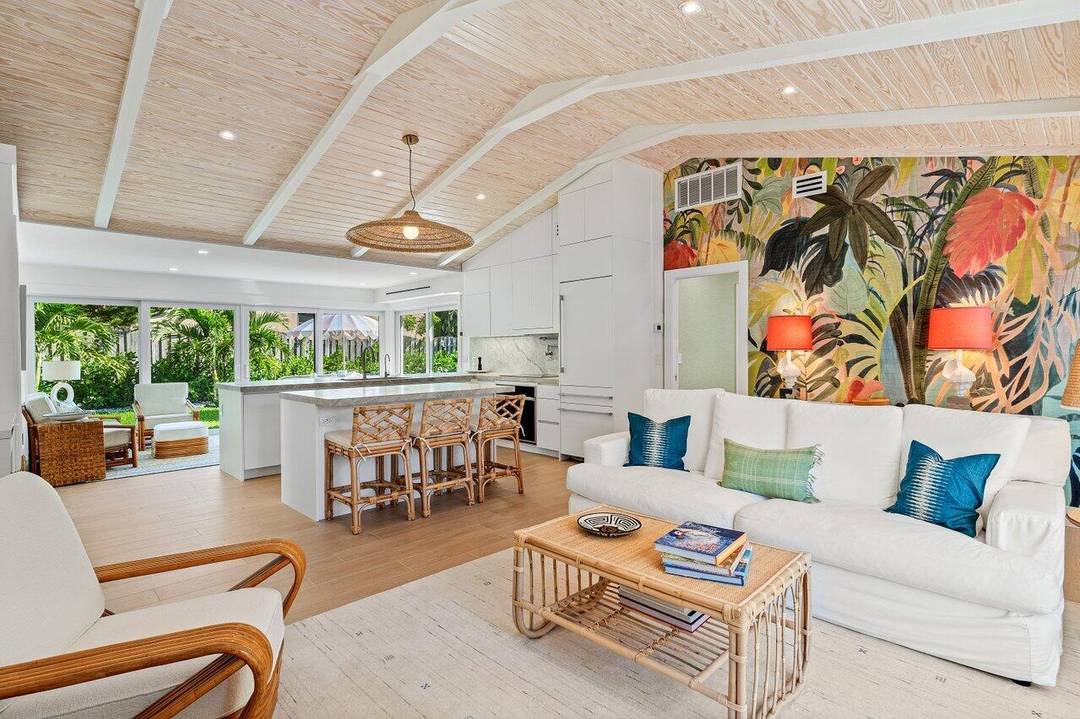 Situated east of A1A, this just renovated beach bungalow features designer finishes, a private pool, and deeded beach access.