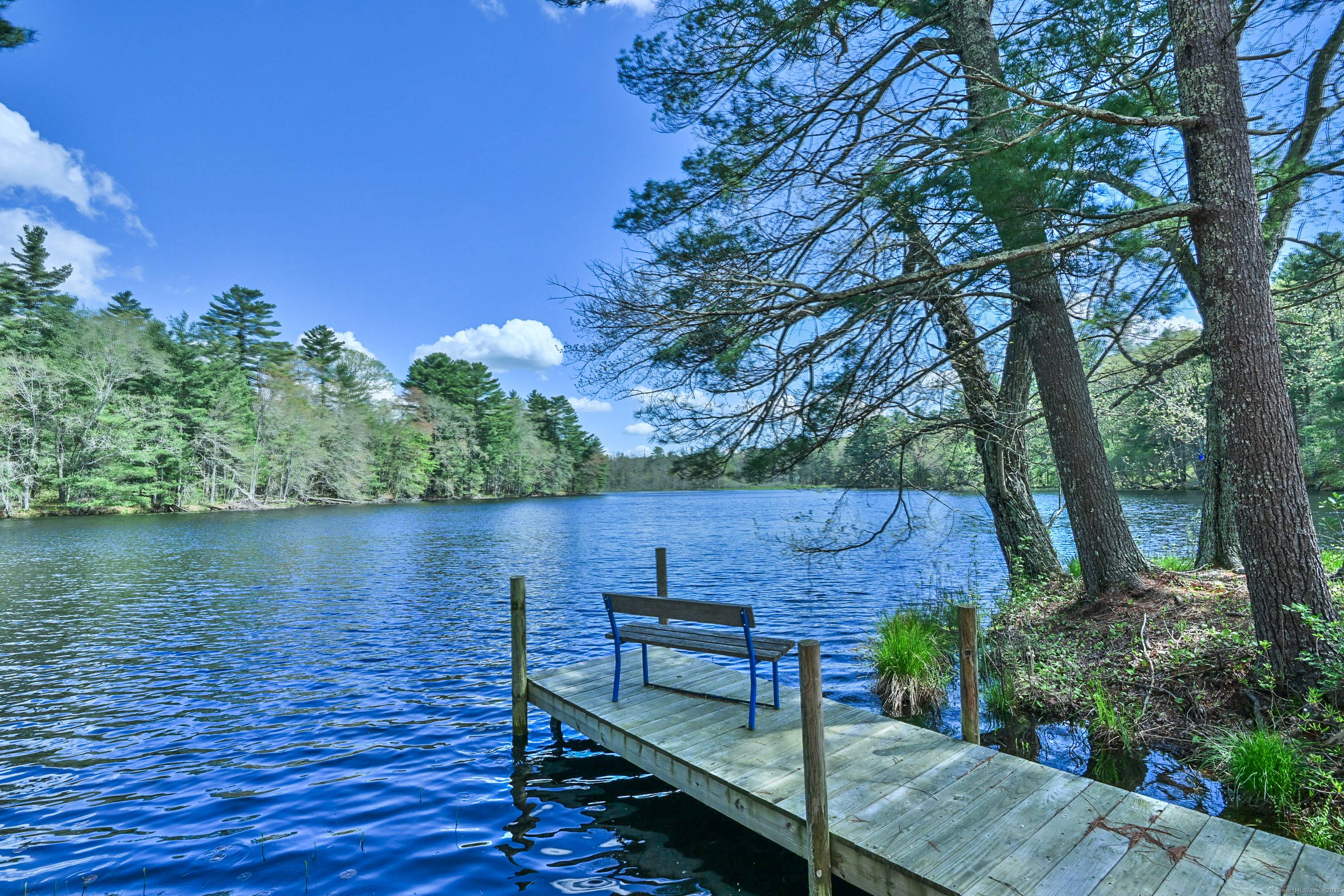 A truly rare and magical offering live immersed in nature on a private, 13 acre brook fed private pond, complete with cascading waterfall, serene wetlands, forested trails and wildflower meadows.