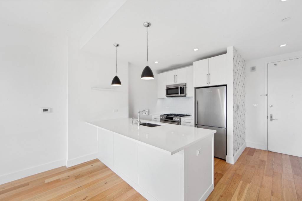 South facing 2 Bed 2 Bath with amazing natural light, efficient layout and in unit washer and dryer in the heart of LIC.