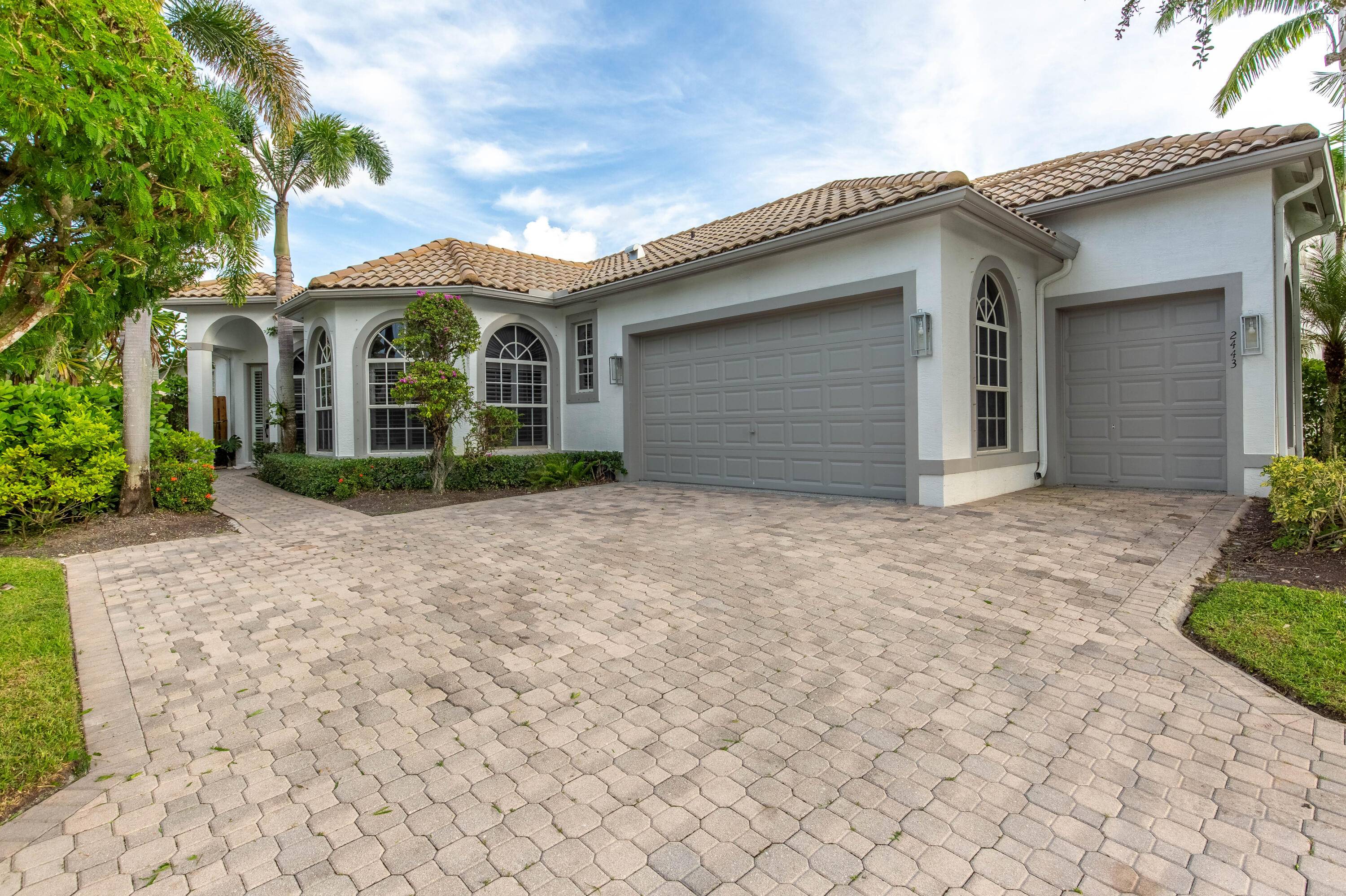 Experience luxury living in this stunning 3 bedroom, 3 bathroom single family pool home, nestled within the prestigious gated community of Palm Beach Polo Golf Country Club.