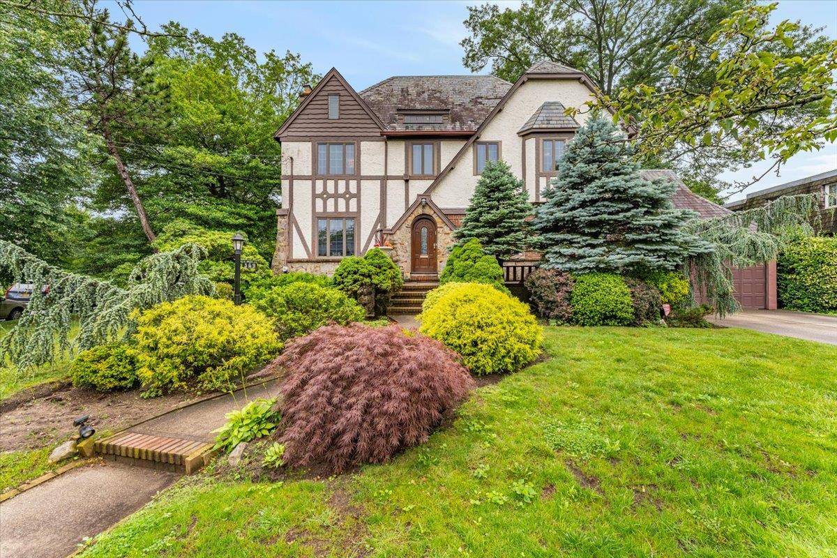 Beautiful Tudor style colonial in prime Woodmere location !