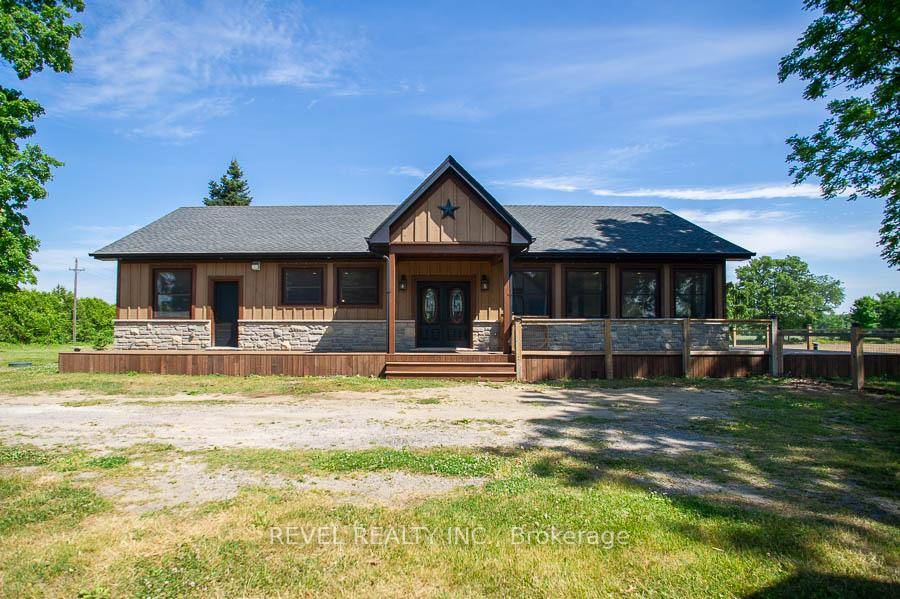 Welcome to 2664 Windham West Quarterline Road, a stunning custom built bungalow on a peaceful one acre lot, surrounded by scenic farmers fields.