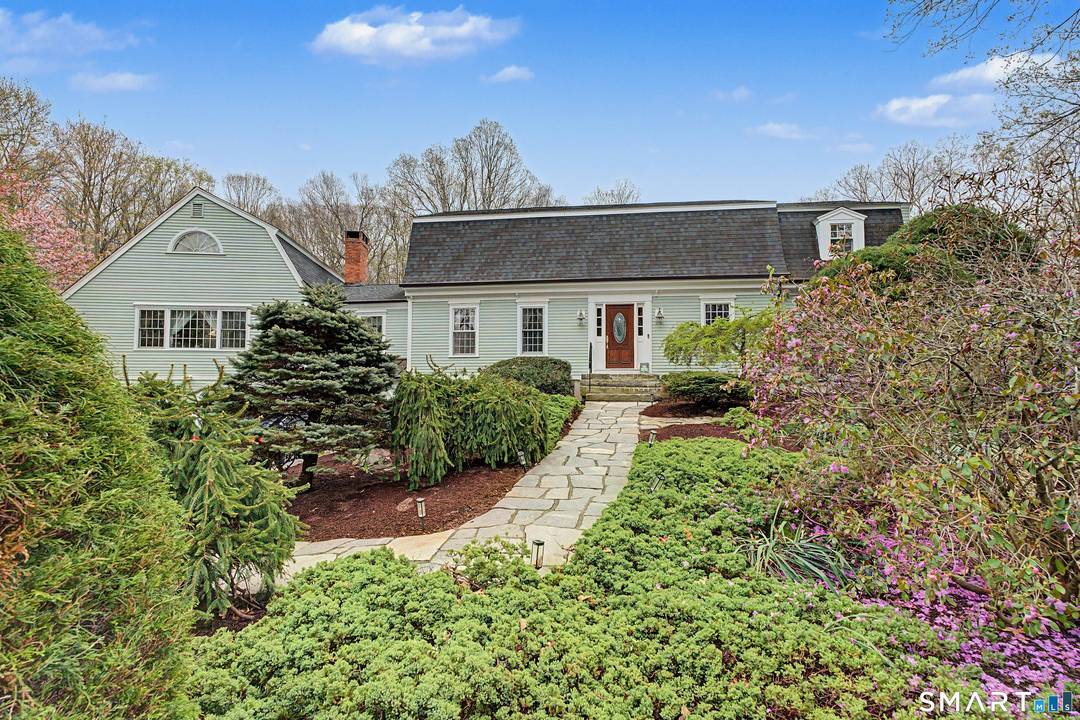 Elegant colonial on a secluded cul de sac, with in law boasts three spacious bedrooms in the main house, complemented by a separate, two bedroom, two level in law suite.