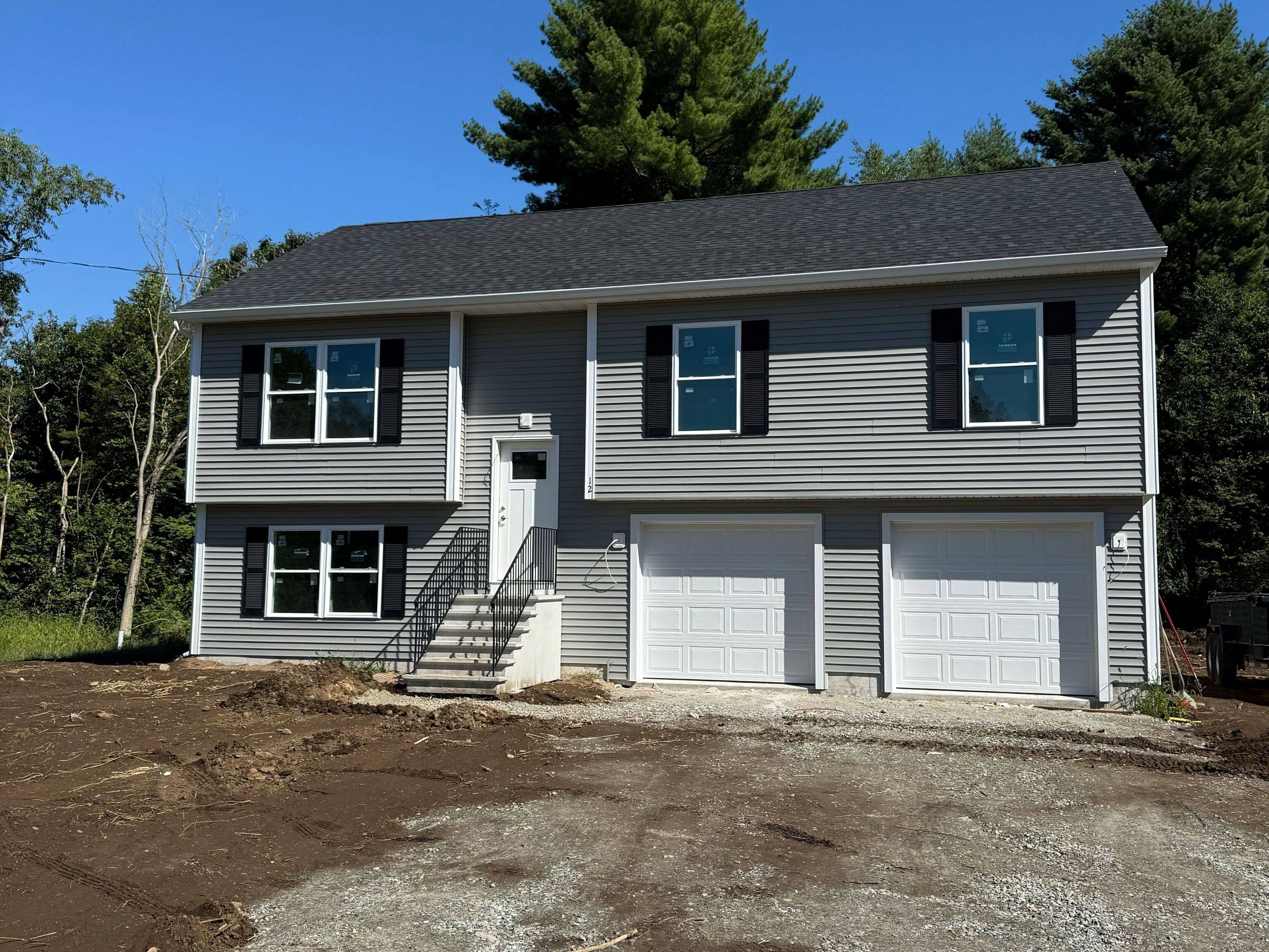 Brand New Contemporary Raised Ranch on a Beautiful 1 Acre Wooded Lot in Brooklyn.