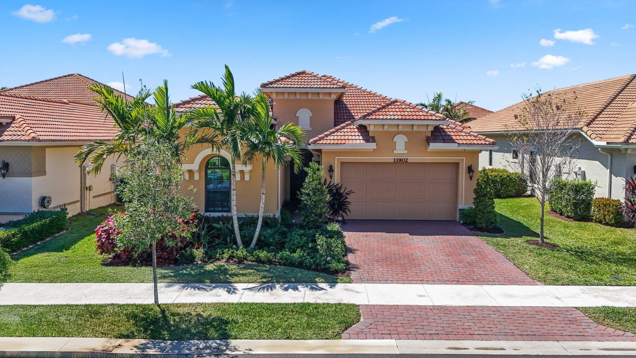 Welcome to your modern oasis at 11902 Palermo Road in Parkland, FL !