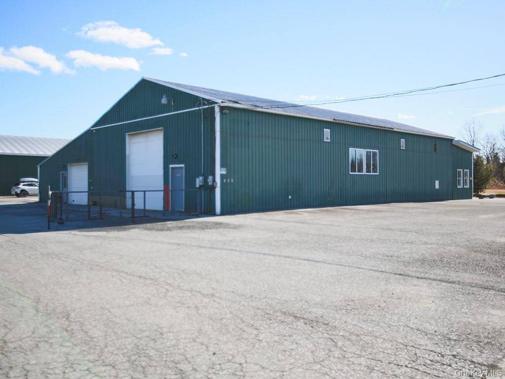 Clean 3042 sf Warehouse Storage Indoor Recreation space with mezzanine and 800 sf office space.