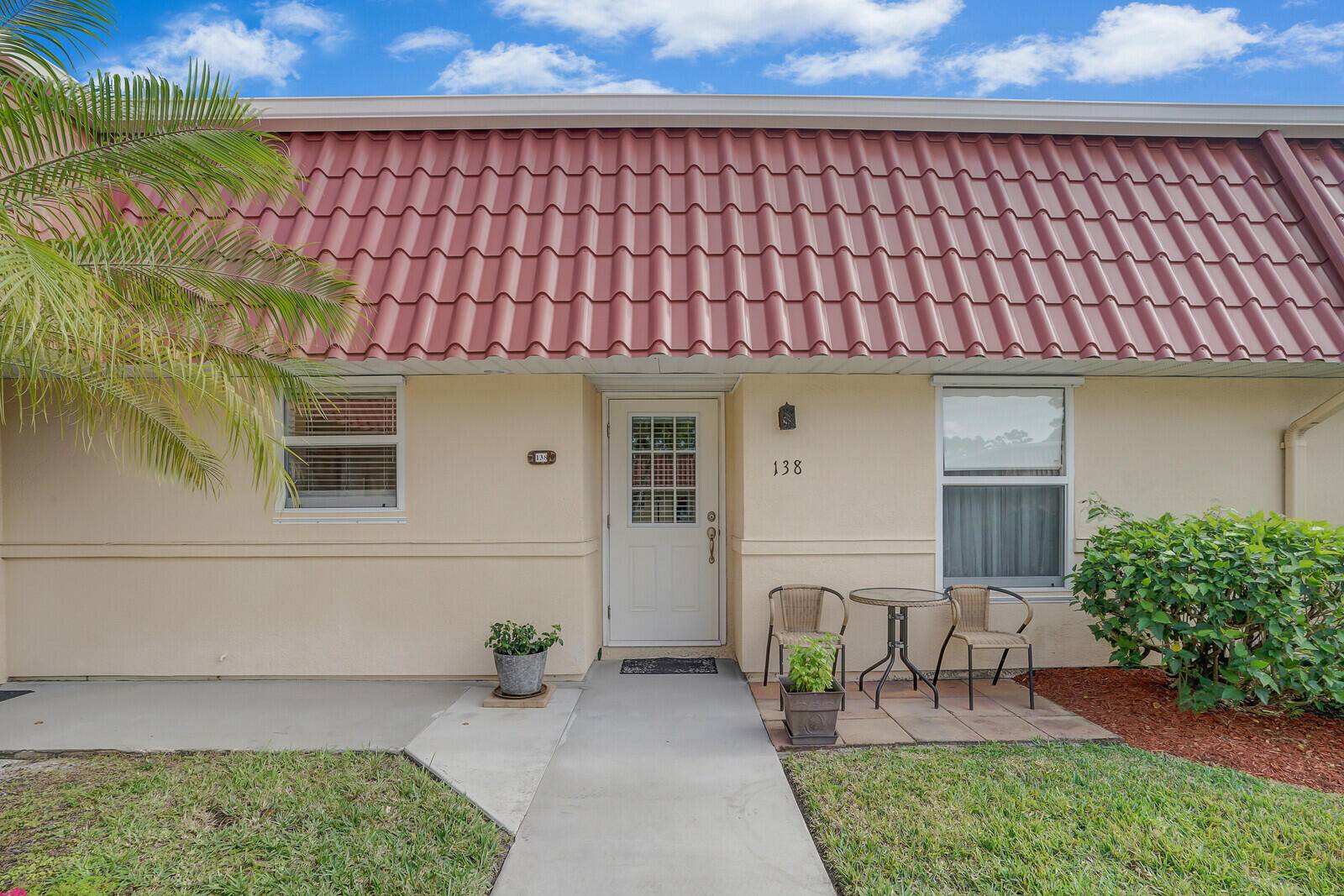 Discover the perfect blend of style and comfort at 138 Amherst Lane, Lake Worth, FL.