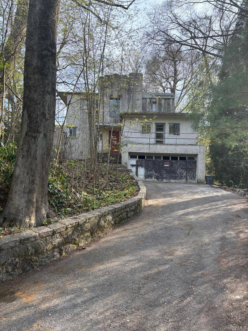 Single family home located at the highly coveted Bronxville Country Club, right next to a hiking trail with beautiful views.