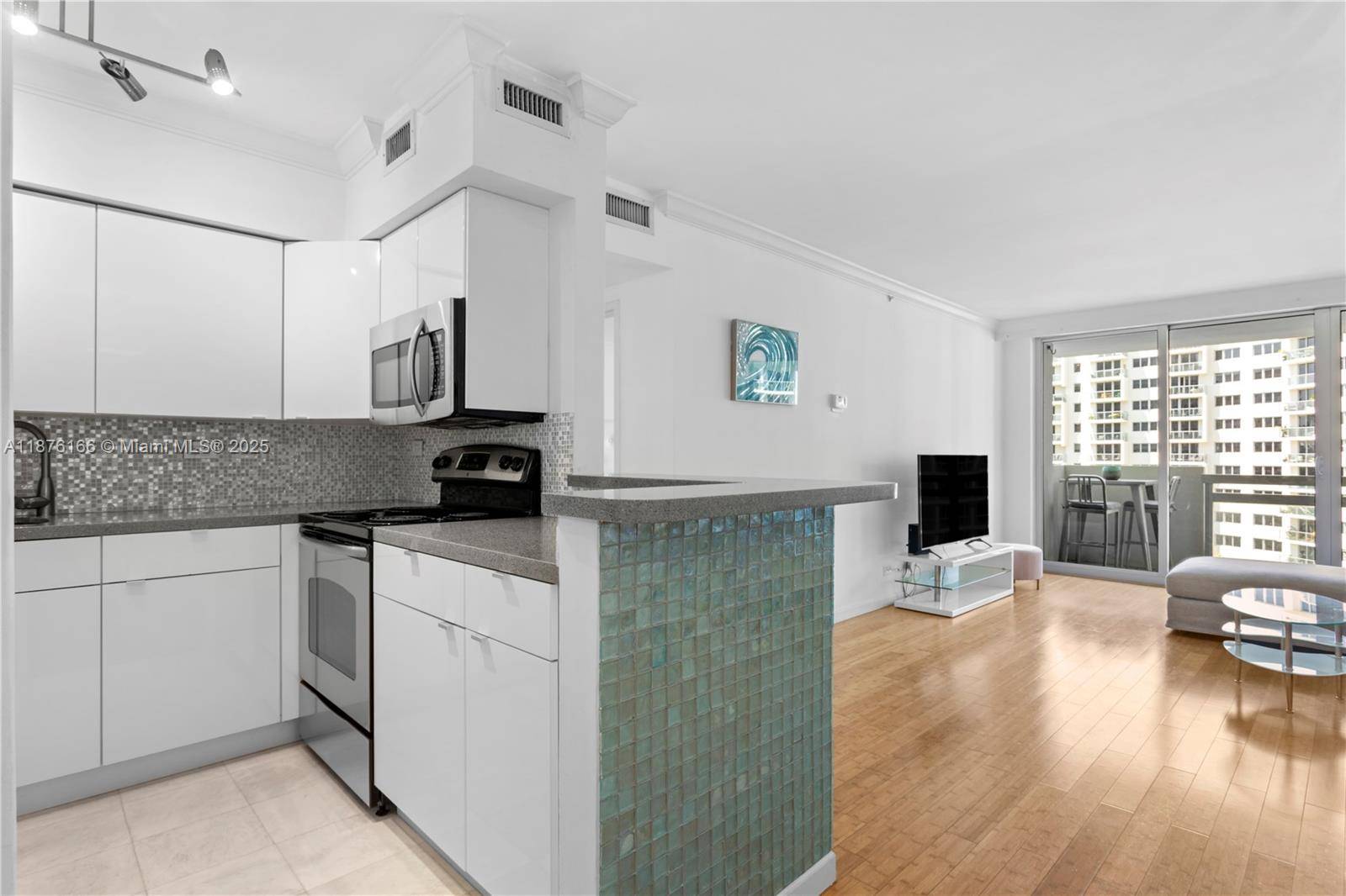 This large one bedroom unit with a walk in closet features a balcony overlooking the flamingo garden and offering incredible bay views.