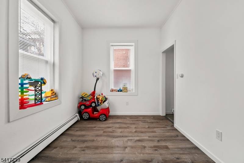 Legal four family brick building located on a corner property in Clifton offering a strong investment opportunity with additional upside potential.