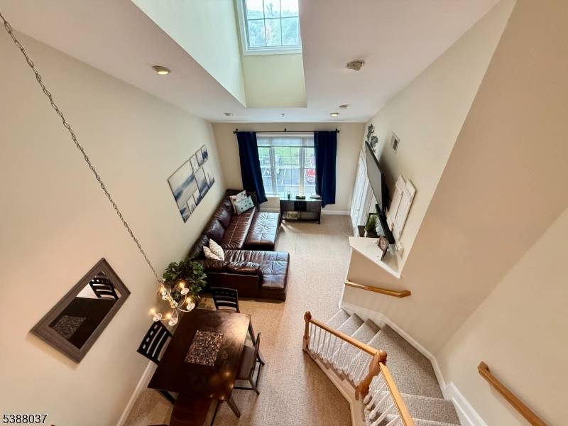 LIVE THE GRANDE LIFE ! Beautiful fourth floor condo featuring a spacious loft that can easily serve as a second bedroom, home office, or creative space.