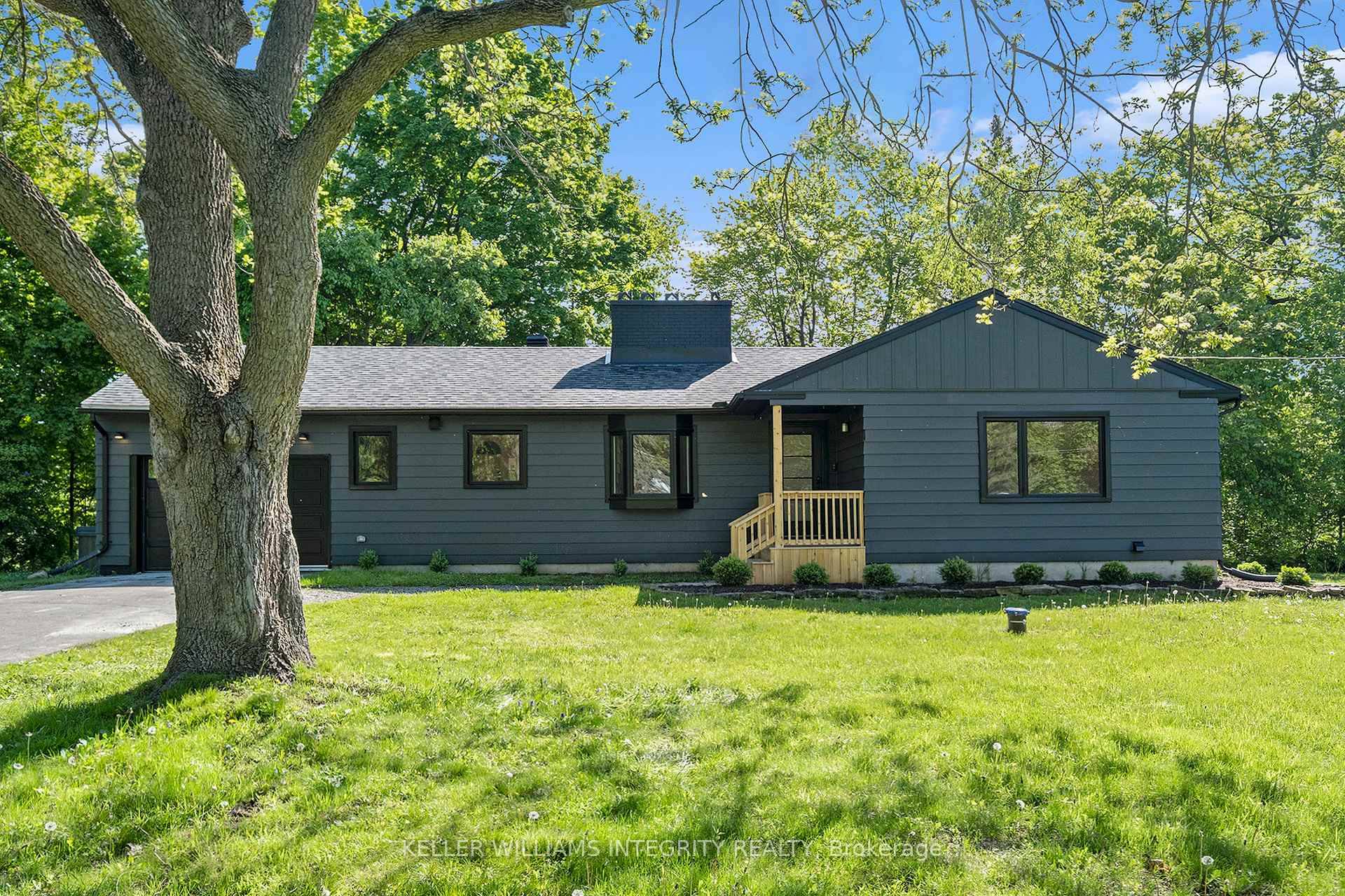 Experience exceptional waterfront living on just under 1.