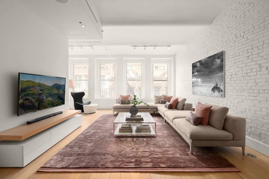 Impeccably Renovated Soho Loft with Timeless Character and Modern Luxury.
