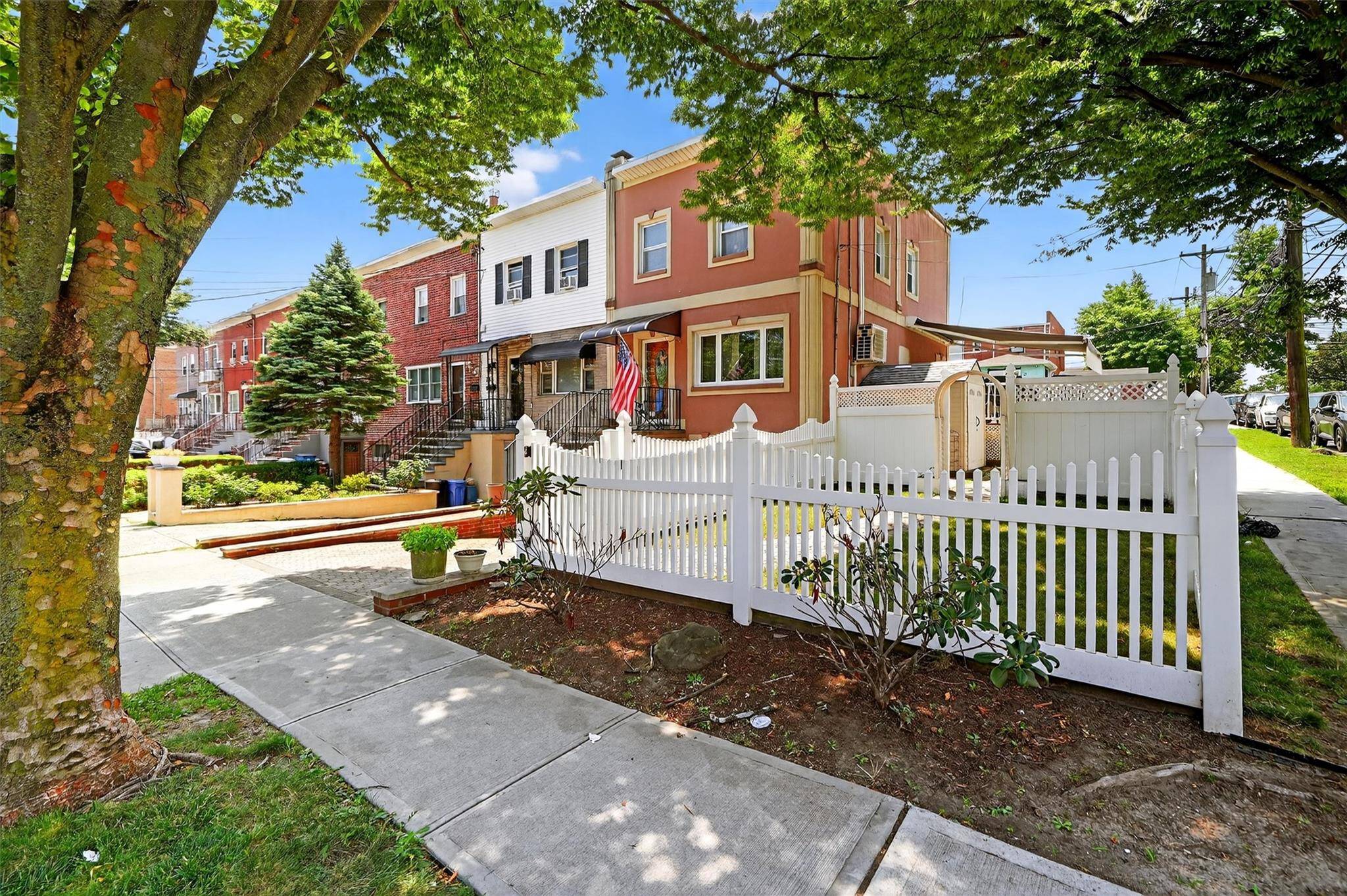 Corner semi attached single family that is stucco brick with large lot.