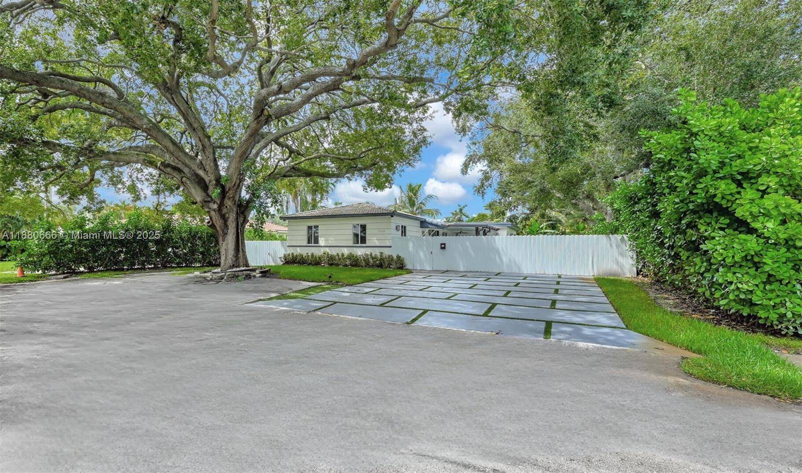 Nestled on one of Biscayne Park s most picturesque tree lined streets, this newly remodeled home features new electrical, plumbing, septic, pool and a covered patio.