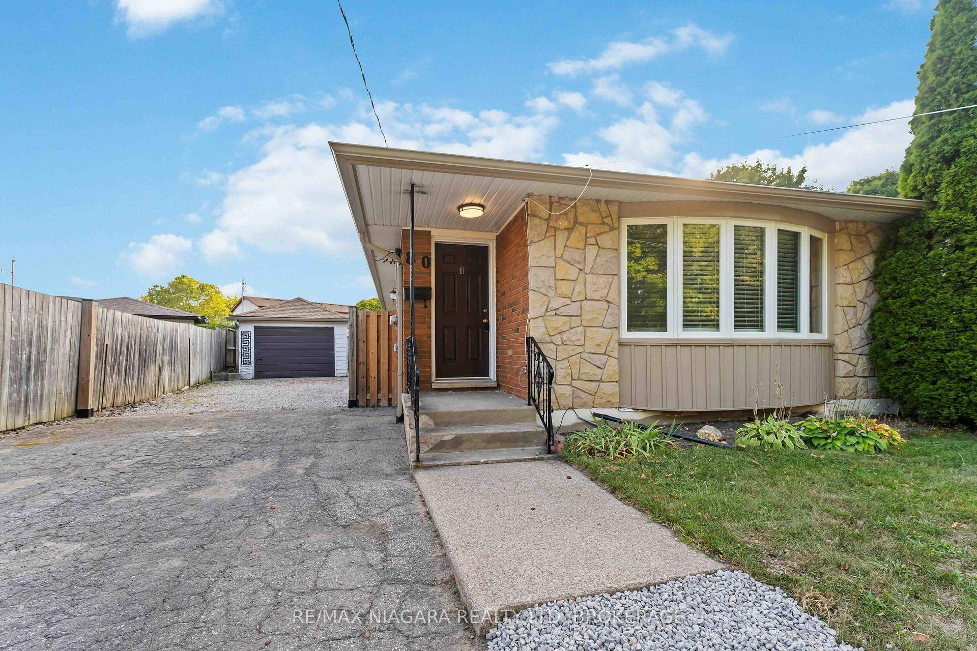 Welcome to this beautifully maintained 3 1 bedroom semi bungalow, perfectly situated with direct backyard access to St.