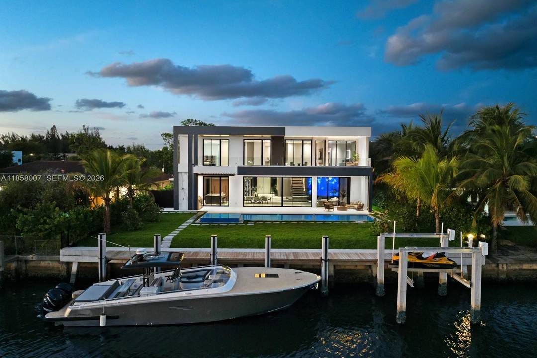 Crafted by Barreto Constructions, this 2024 new construction waterfront estate presents a rare opportunity within the gated enclave of Golden Isles.