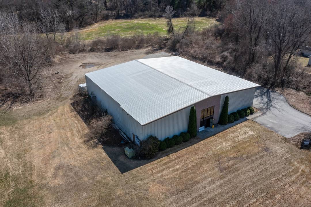 Located in the Woodstock Industrial Park, this versatile 10, 000 sq ft metal building offers endless possibilities for industrial, manufacturing, or storage use.