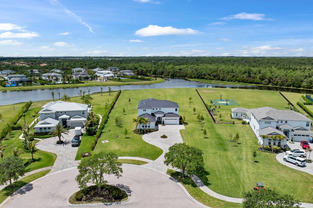 Experience a RARE level of LUXURY in this completely reimagined estate, ideally positioned on one of the LARGEST and most PRIVATE lots within the prestigious Bridgewater community of Jupiter.