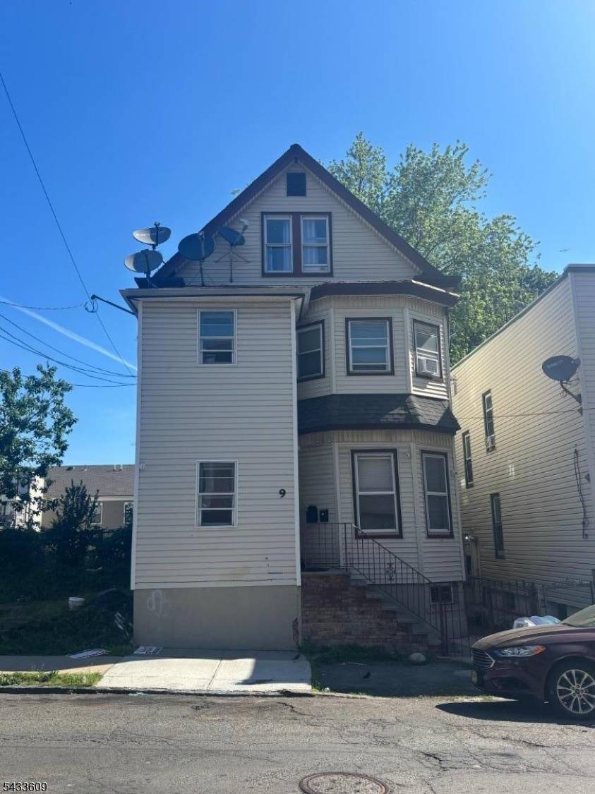 Welcome home to this updated extremely spacious 2 family property with a walk up 3rd floor bonus unit.