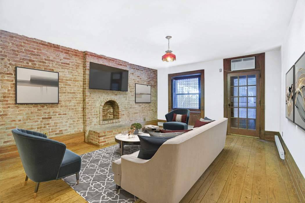 This full floor garden duplex has been lovingly restored and maintains the originality and scale of the townhome's 15 foot wide Federal design.