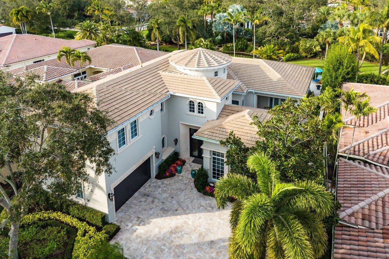 Experience luxury living in the prestigious Old Palm Golf Club.