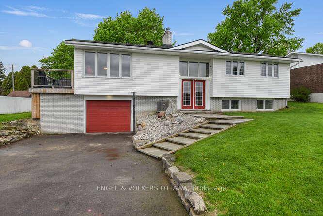 Charming side split home on an oversized lot, ideally located next to the Iroquois Golf Club.