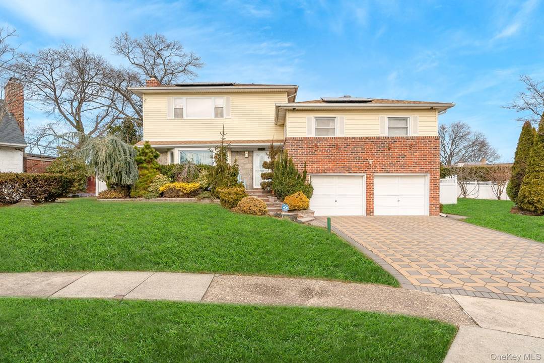 This spacious home is nestled on a quiet cul de sac in West Hempstead, offering ample room for hosting and entertaining.