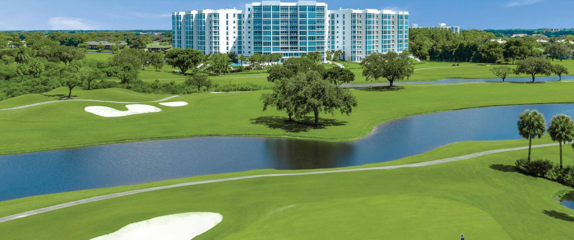 Exquisite 4th floor apartment in the luxurious Akoya Building of Boca West CC with 2 SPACIOUS EN SUITE BEDROOMS, a den office floor to ceiling impact windows which frame PANORAMIC ...