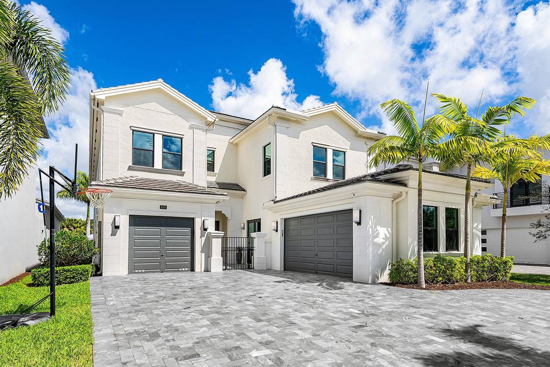 Welcome to a truly turnkey, designer finished masterpiece newly reimagined by MICHAEL GRAY INTERIORS in the prestigious Boca Bridges.