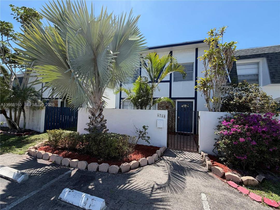 Beautifully renovated end unit townhouse offering 3 bedrooms plus an additional entry level room office, 2 full bathrooms, and 1 half bath.