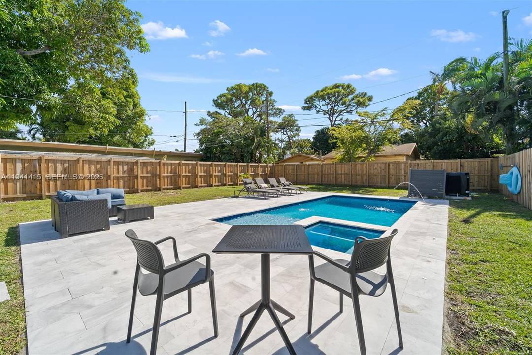 Tastefully updated 2 bedroom home with new heated swimming pool 12x25 amp ; hot tub.