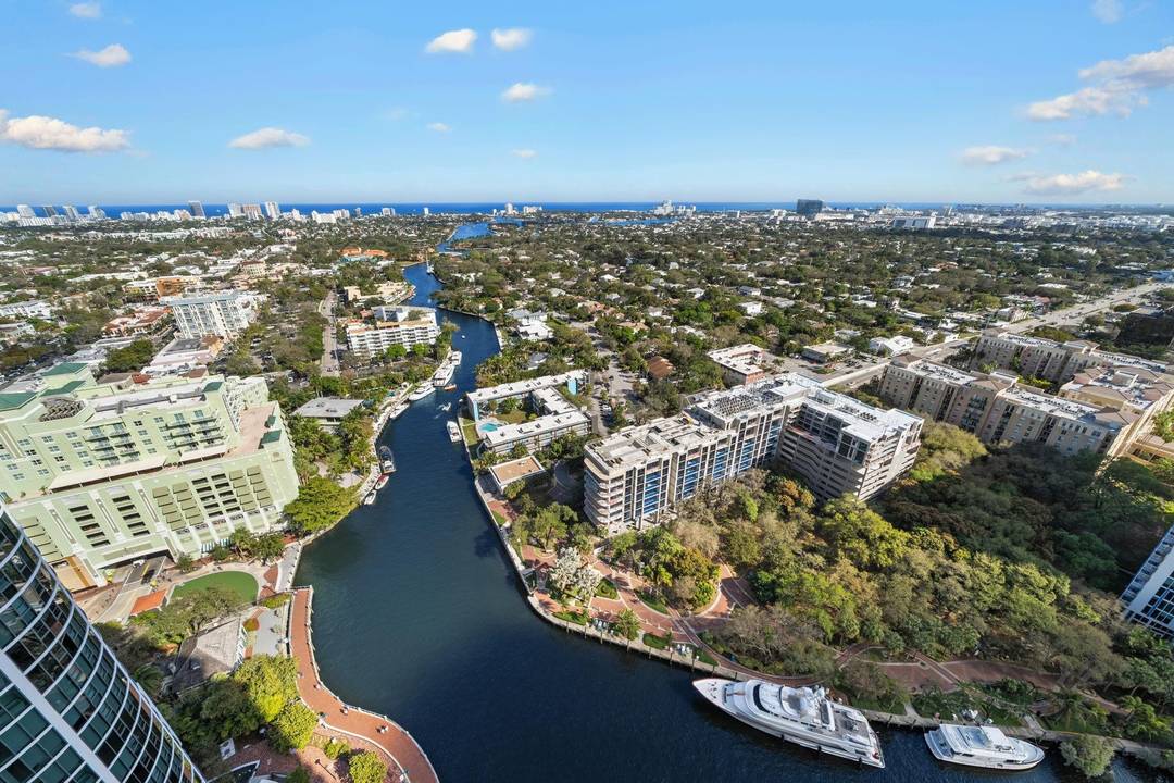 ESCAPE THE COLD ! RARELY AVAILABLE STUNNING HIGH FLOOR CHAMPAGNE MODEL WITH BREATHTAKING VIEWS ENCOMPASSING WATERWAYS OF FORT LAUDERDALE AND VIBRANT LIGHTS OF LAS OLAS WITH TWO TERRACES.