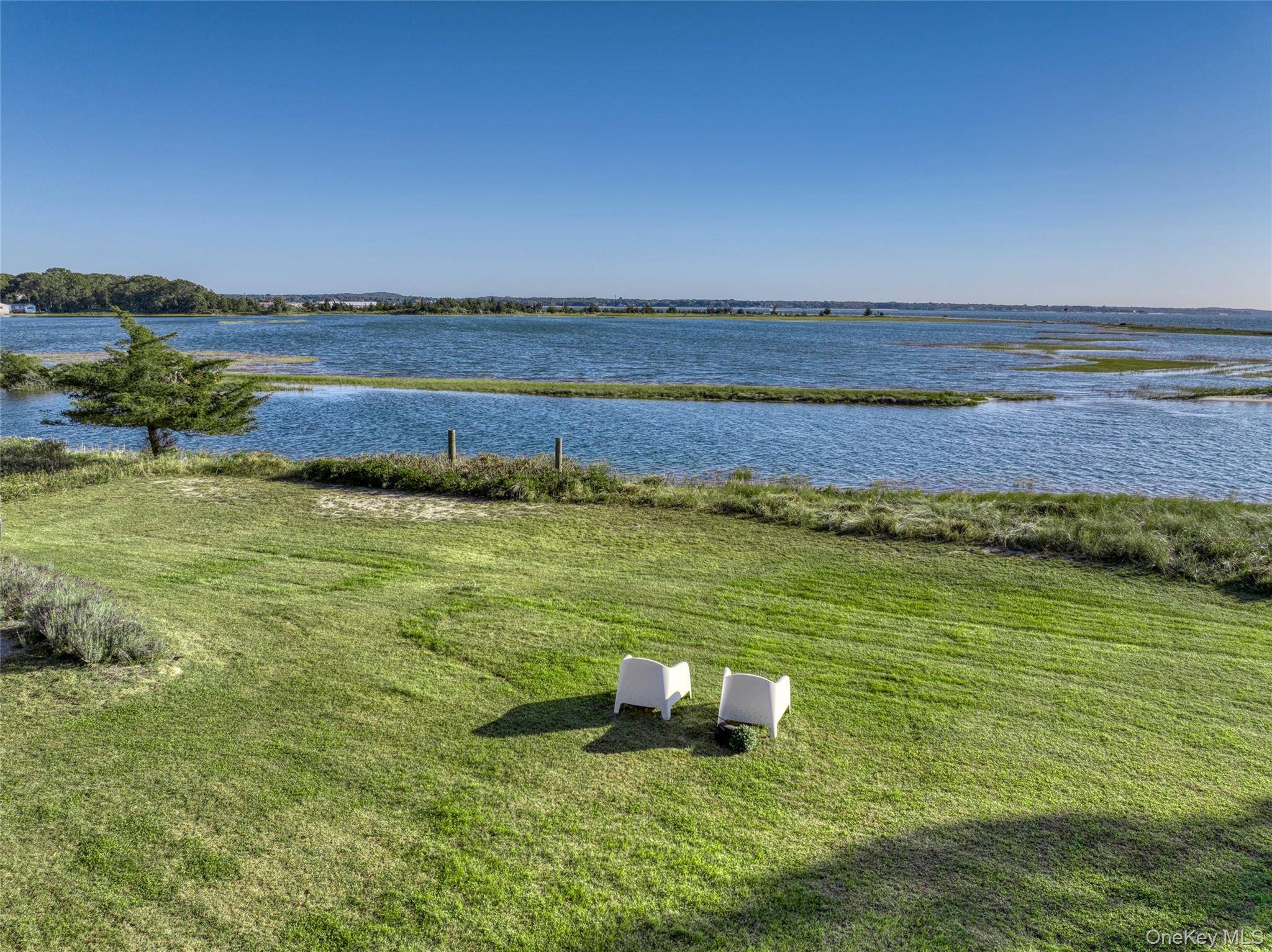 Wake up to endless views of the Peconic Bay sunlight glimmering off the water, birds gliding over the nearby nature preserve, and the calm rhythm of the deep water inlet ...