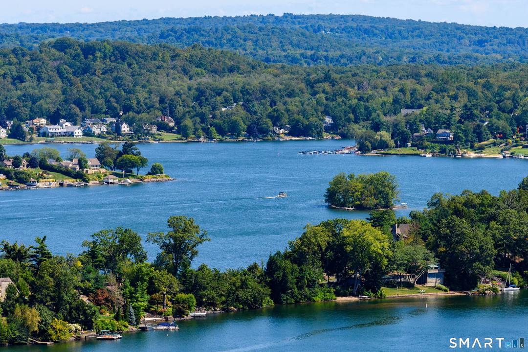 MILLION DOLLAR VIEWS ! Enjoy spectacular year round views of Candlewood Lake from the Living Room, Kitchen, Loft or Deck.