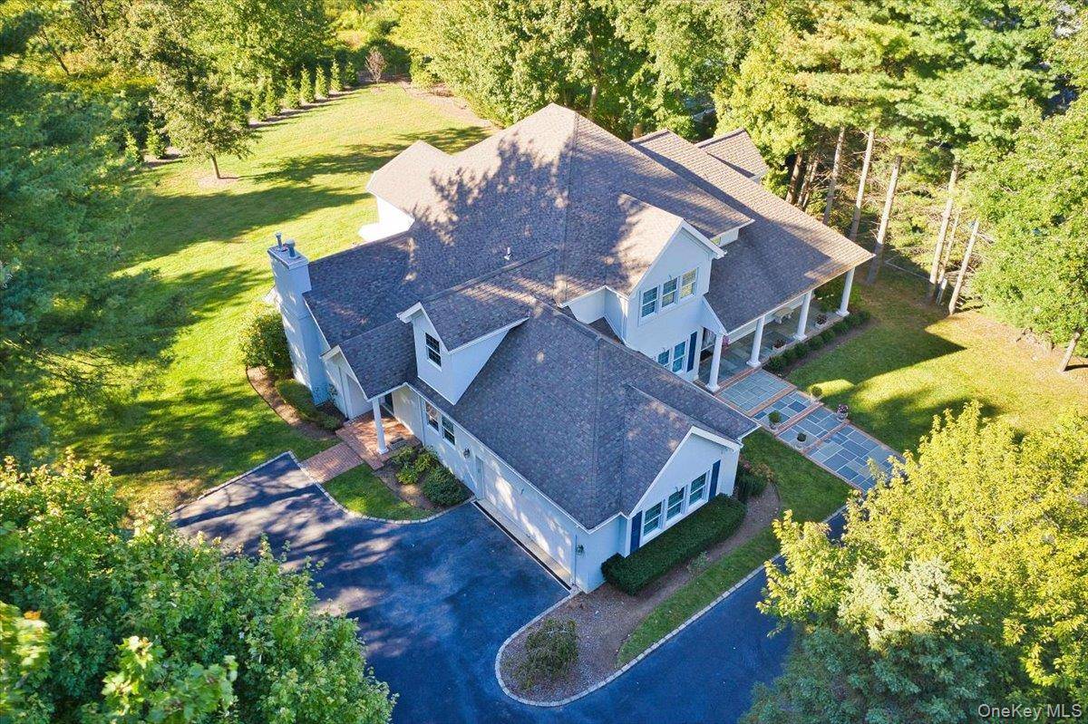 Welcome to 5 Morgan Lane, a stately colonial tucked away in the exclusive and private Morgan Lane enclave of Locust Valley.