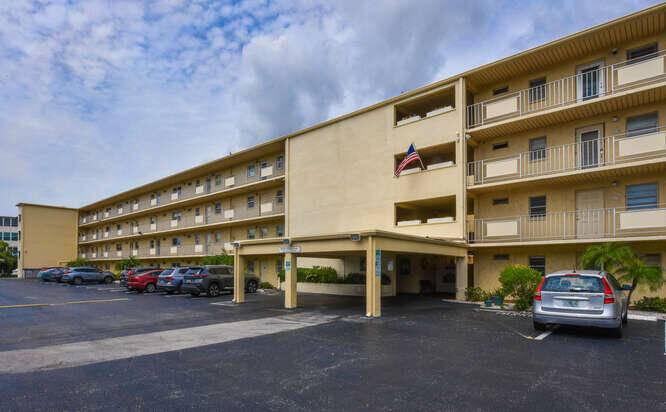 Beautiful, convenient secure, this updated 2 bedroom, 2 bath condo at Village Royale on the Green features an enclosed, air conditioned lanai.