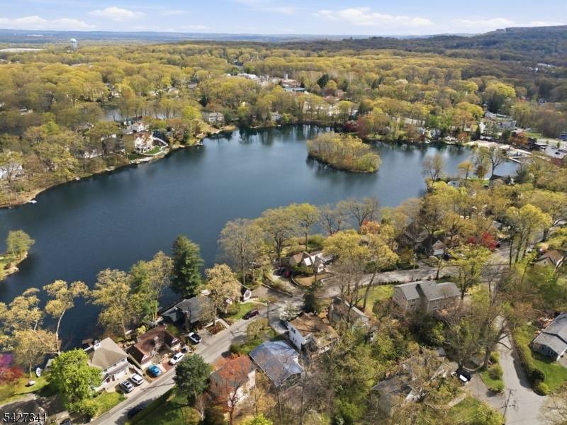 A charming sun filled ranch style home nestled in the Lake Arrowhead community of Denville.