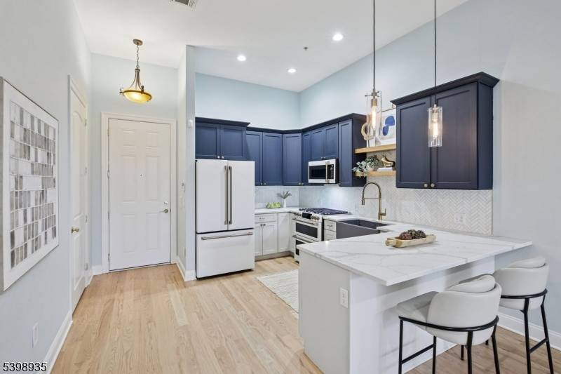 Modern living abounds in this newly renovated, sun drenched, first floor, loft style condo.