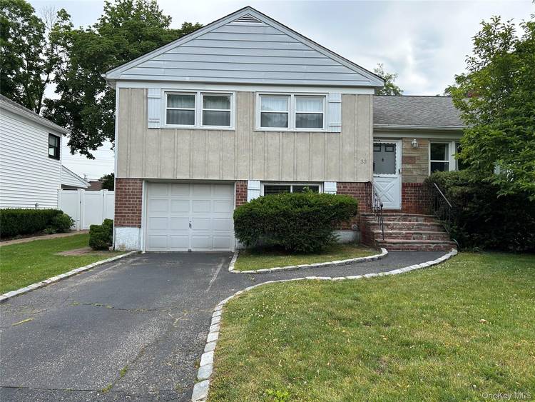Welcome to this charming and spacious 3 bedroom, 3 bath Split level home.