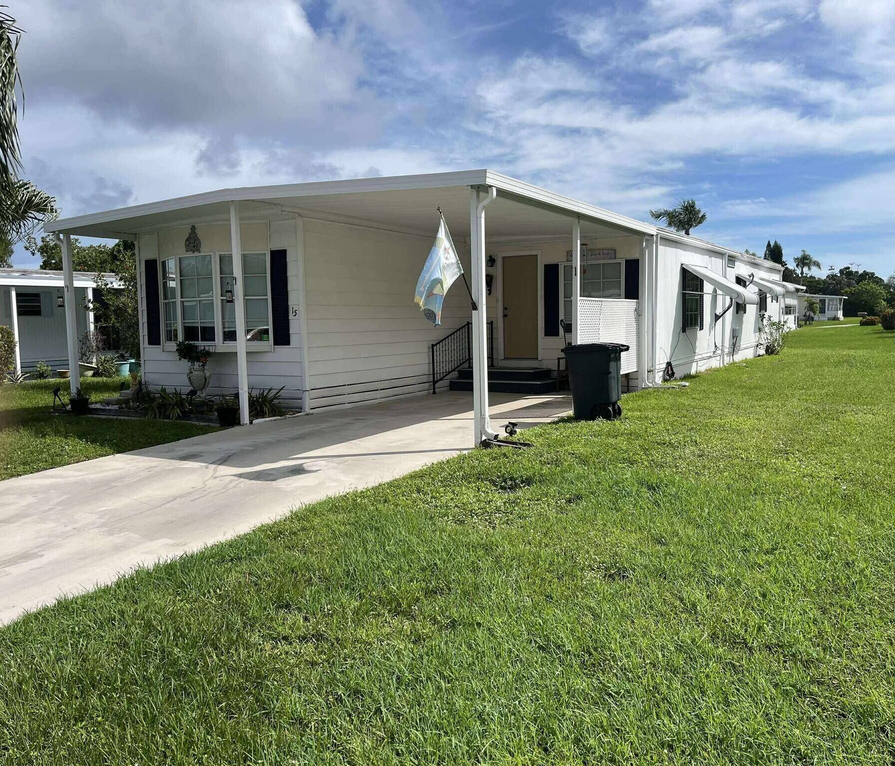 Welcome to 15 La Costa Lane, a charming 2 bedroom, 2 bath residence nestled in the active 55 community of Spanish Lakes Golf Village in Port St.