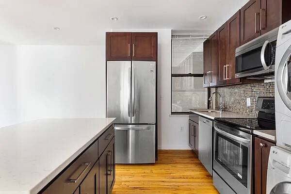 Bright and spacious corner 3 bedroom apartment with chef s kitchen in prime North Park Slope.