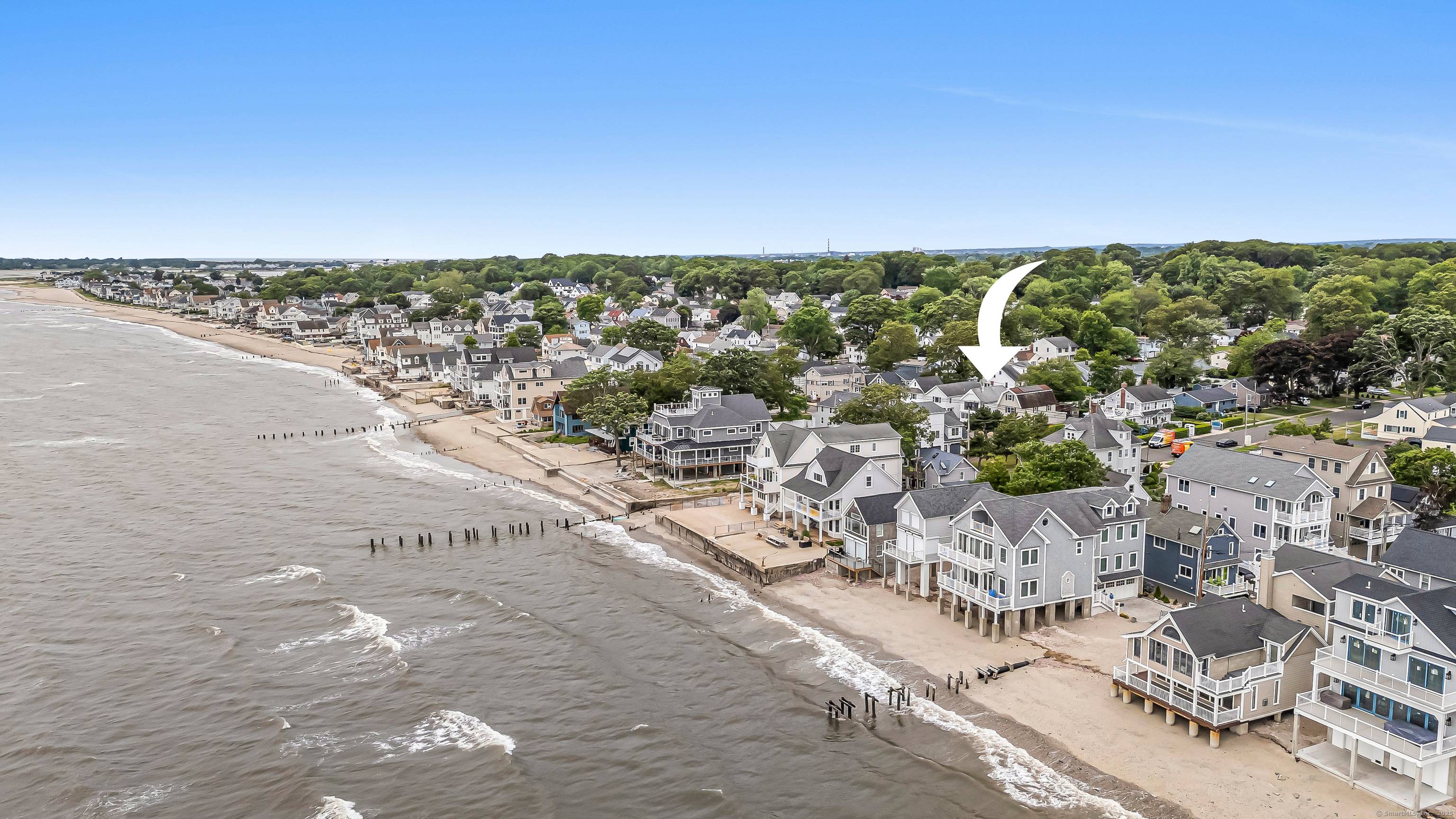 Nestled in Milford's charming beach community, a storybook Craftsman style home.