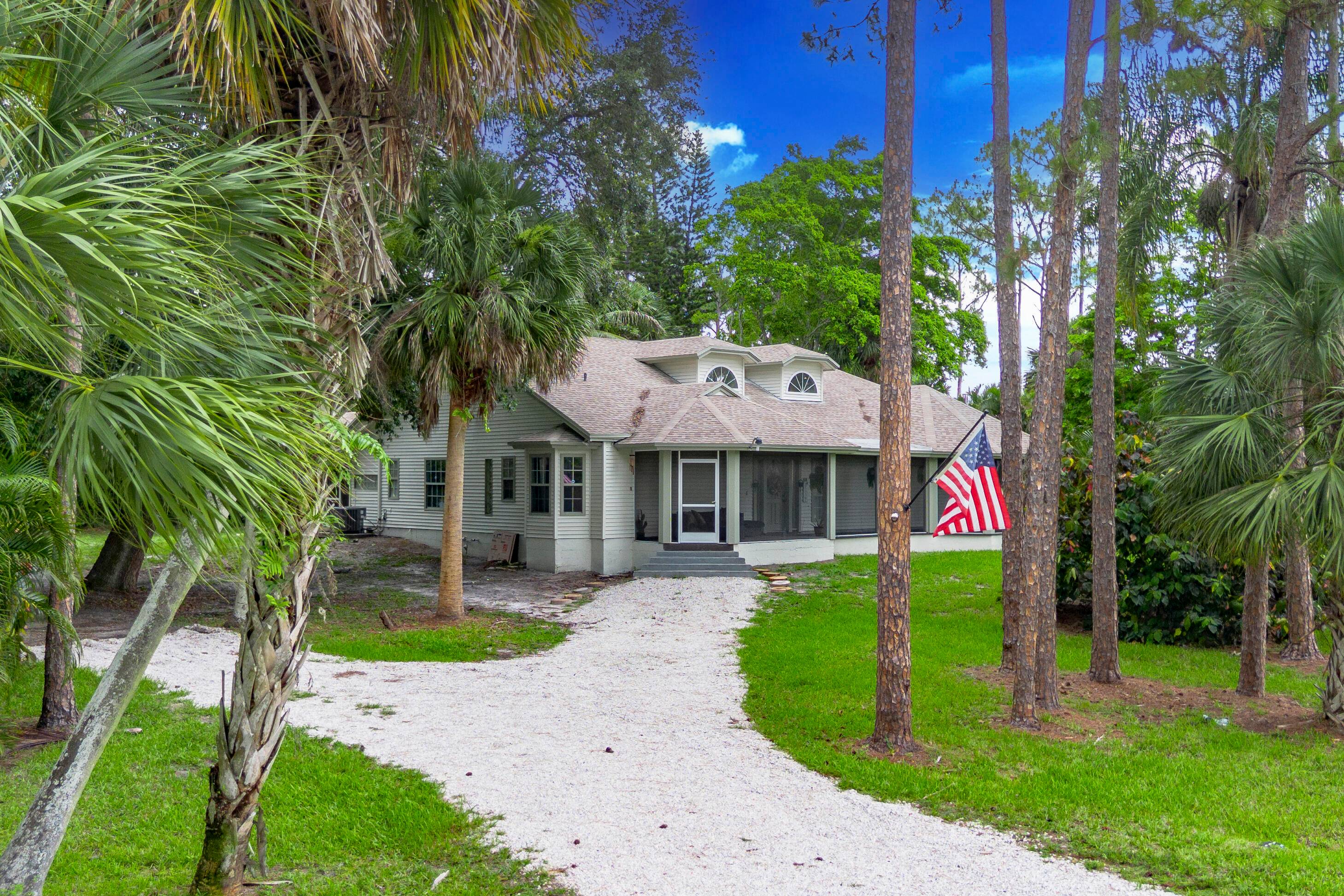 Fully renovated and fully furnished, this beautiful 3 bed, 3 bath Plus Den Office, sits on over an acre in Loxahatchee and is completely move in ready.