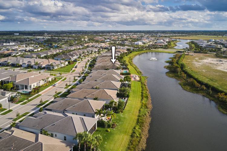 Spectacular lake view home in Avenir's top 55 active adult community called Regency.