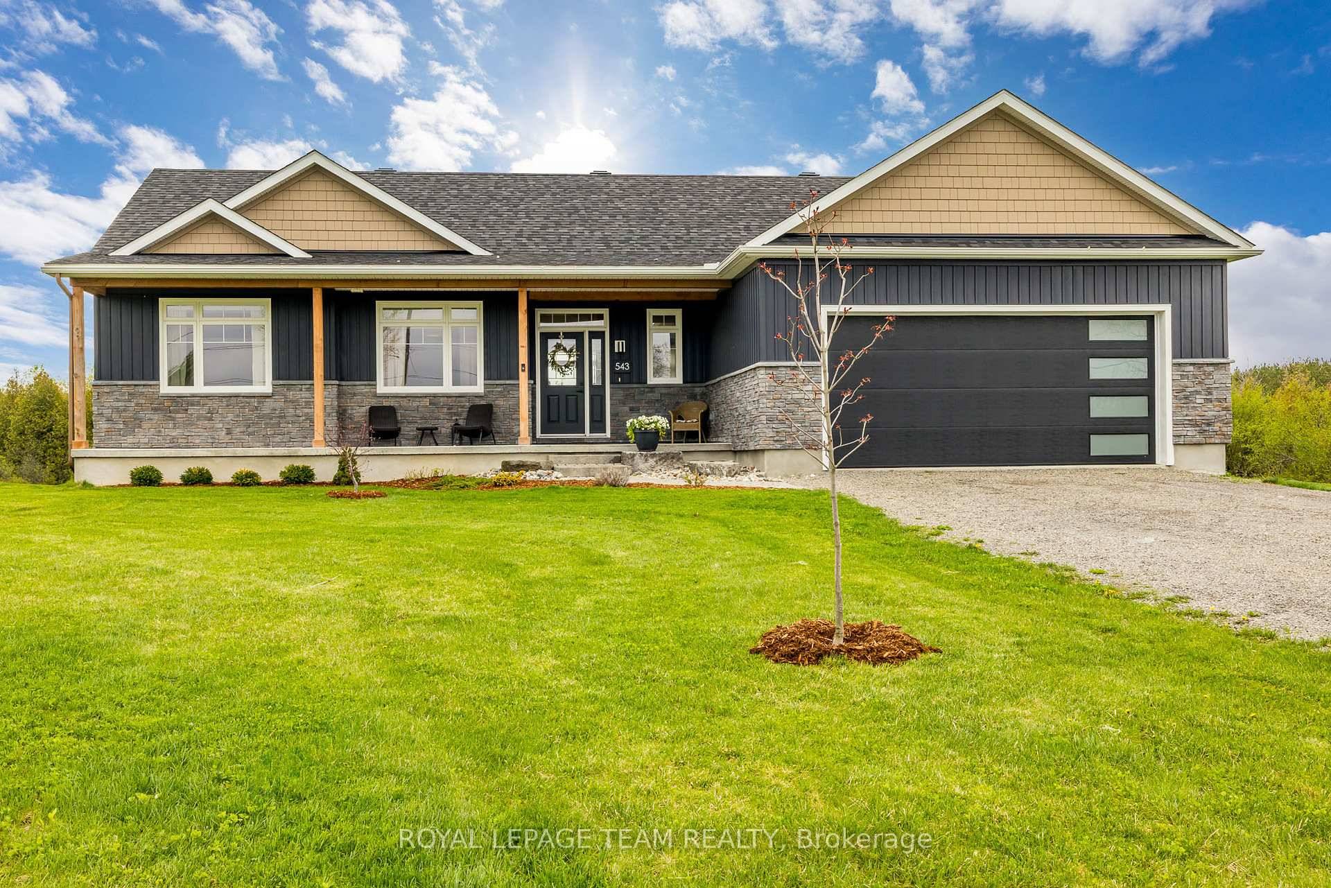 Welcome to 543 McCrea Road a beautifully built 2021 bungalow on 1.