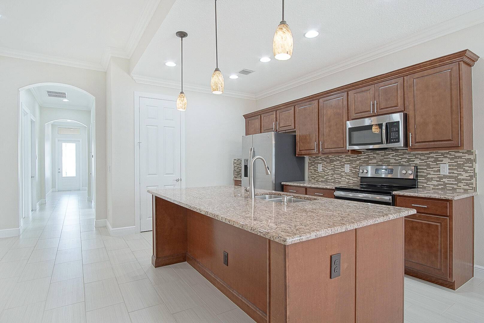 Location, spacious and meticulously maintained best describe this gorgeous Three Oaks 2 BR with den that could be 3rd BR 2 bath villa.