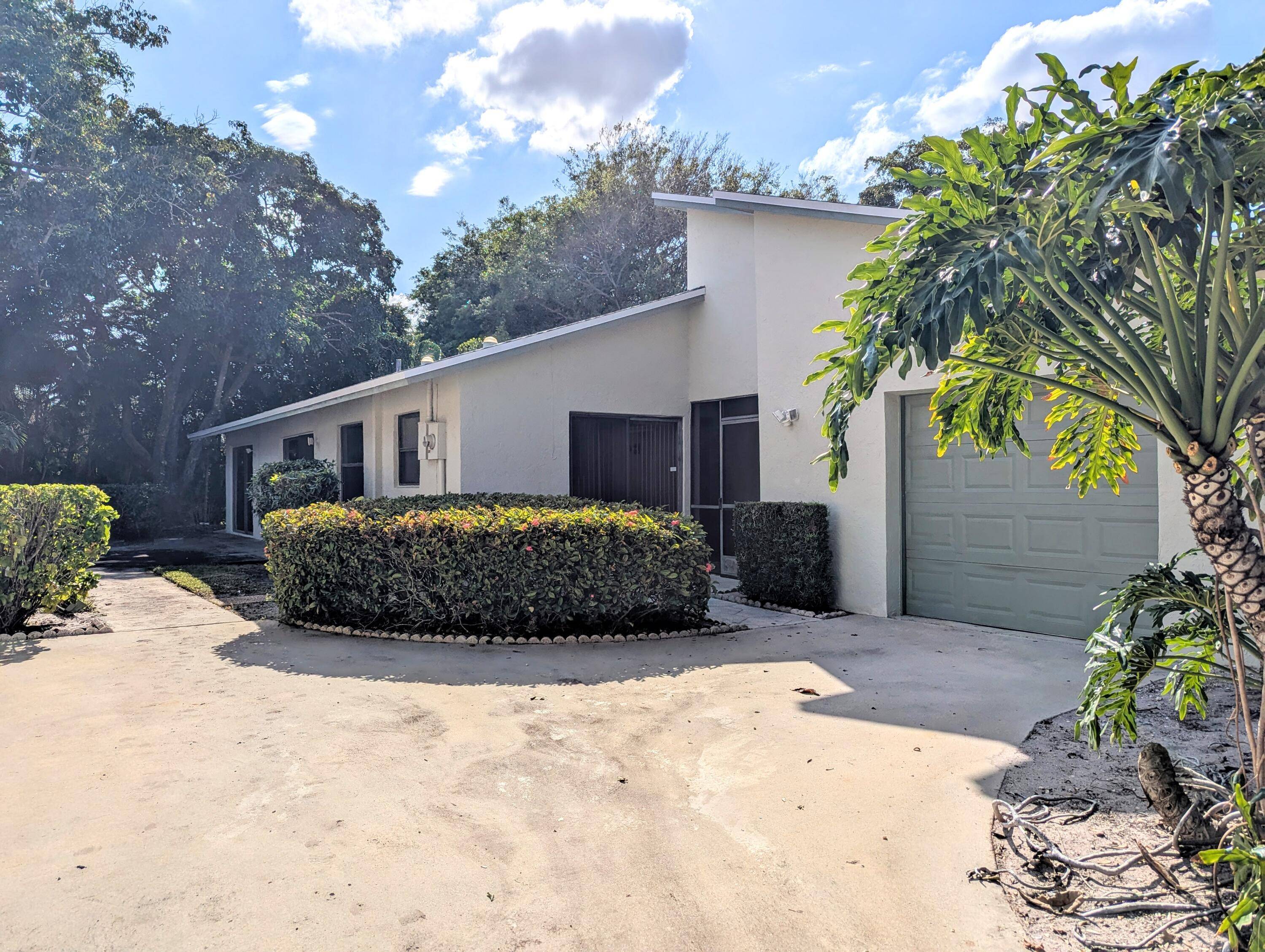 Great Value ! Spacious East Delray Single Family Home with 2 car garage in gated community with fabulous amenities.
