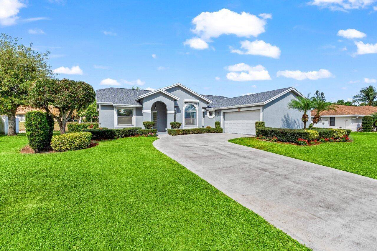 This Delray Beach home features a brand new roof, freshly painted interior and exterior, updated landscaping, and an expansive two car garage with an epoxy floor.